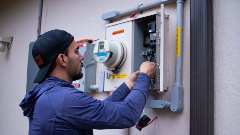 a man using a machine - home energy audit